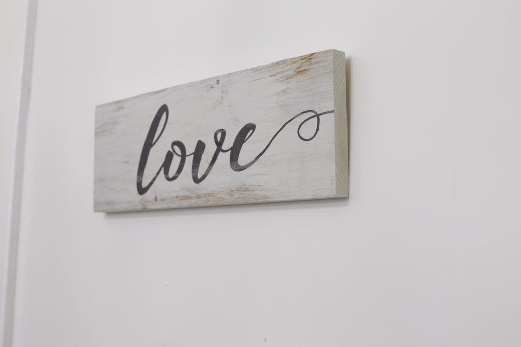 Wooden sign that says Love